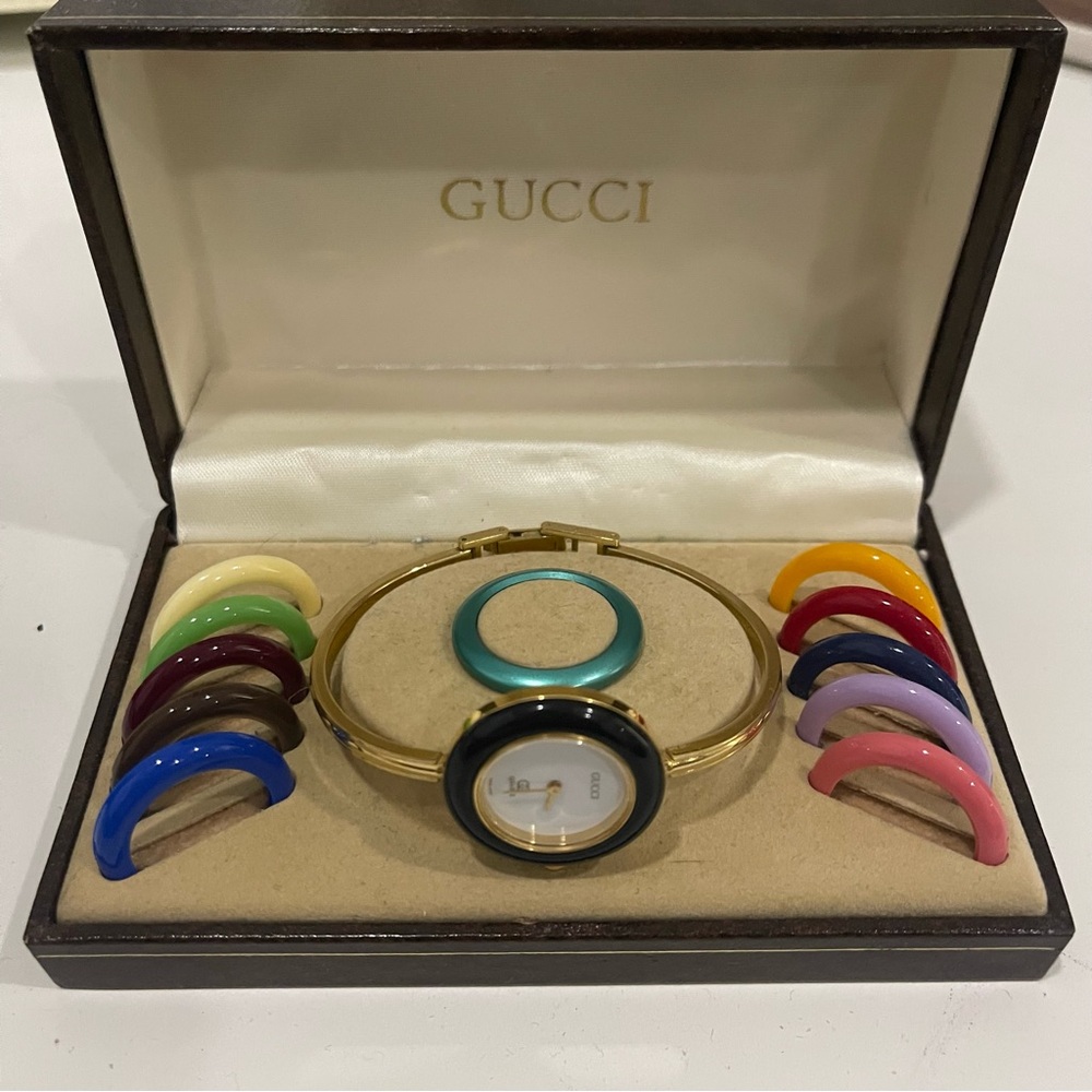 Women’s vintage Gucci Gold Bangle Watch with Interchangeable Bezels and box